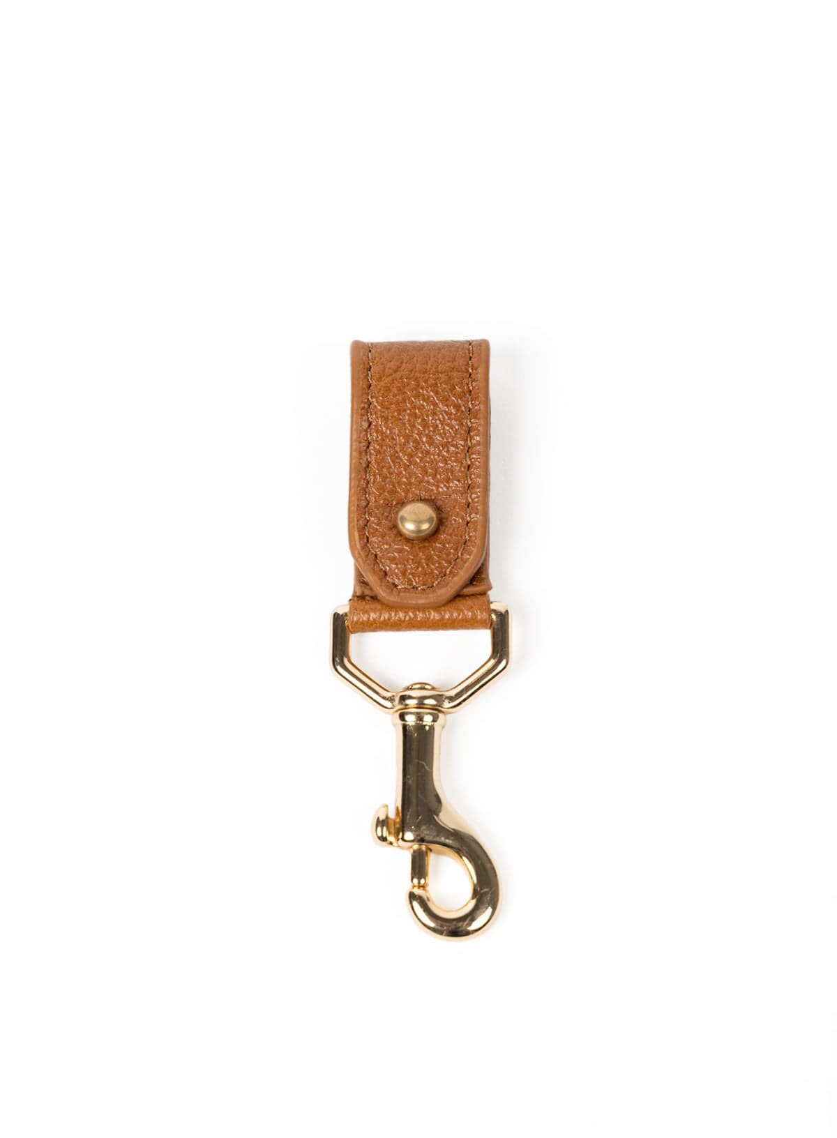 Cognac leather key chain with gold clasp on a white background