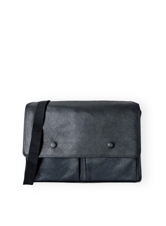 Black leather bag with a strap on a white background