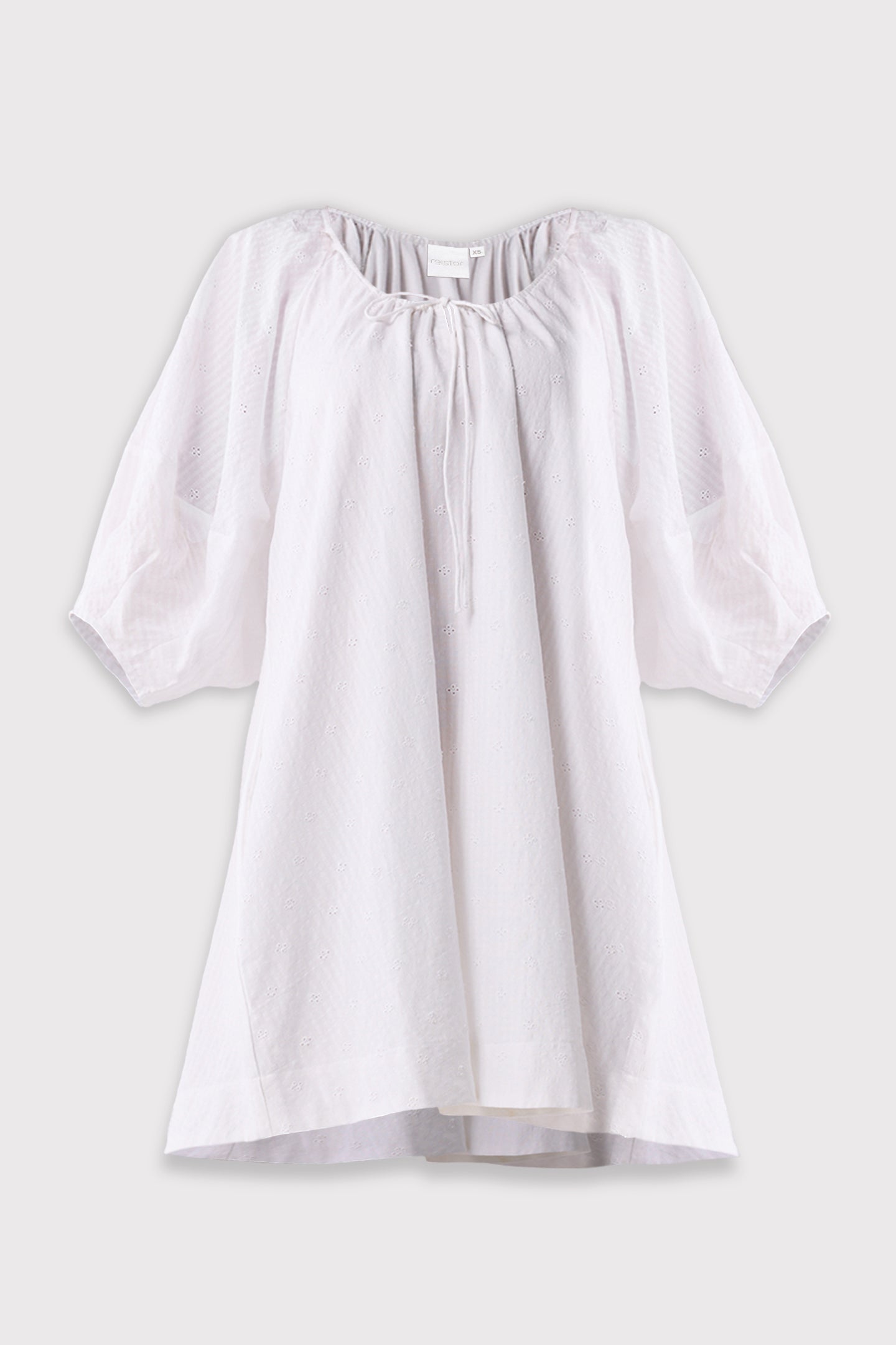 White blouse with puff sleeves on a light gray background