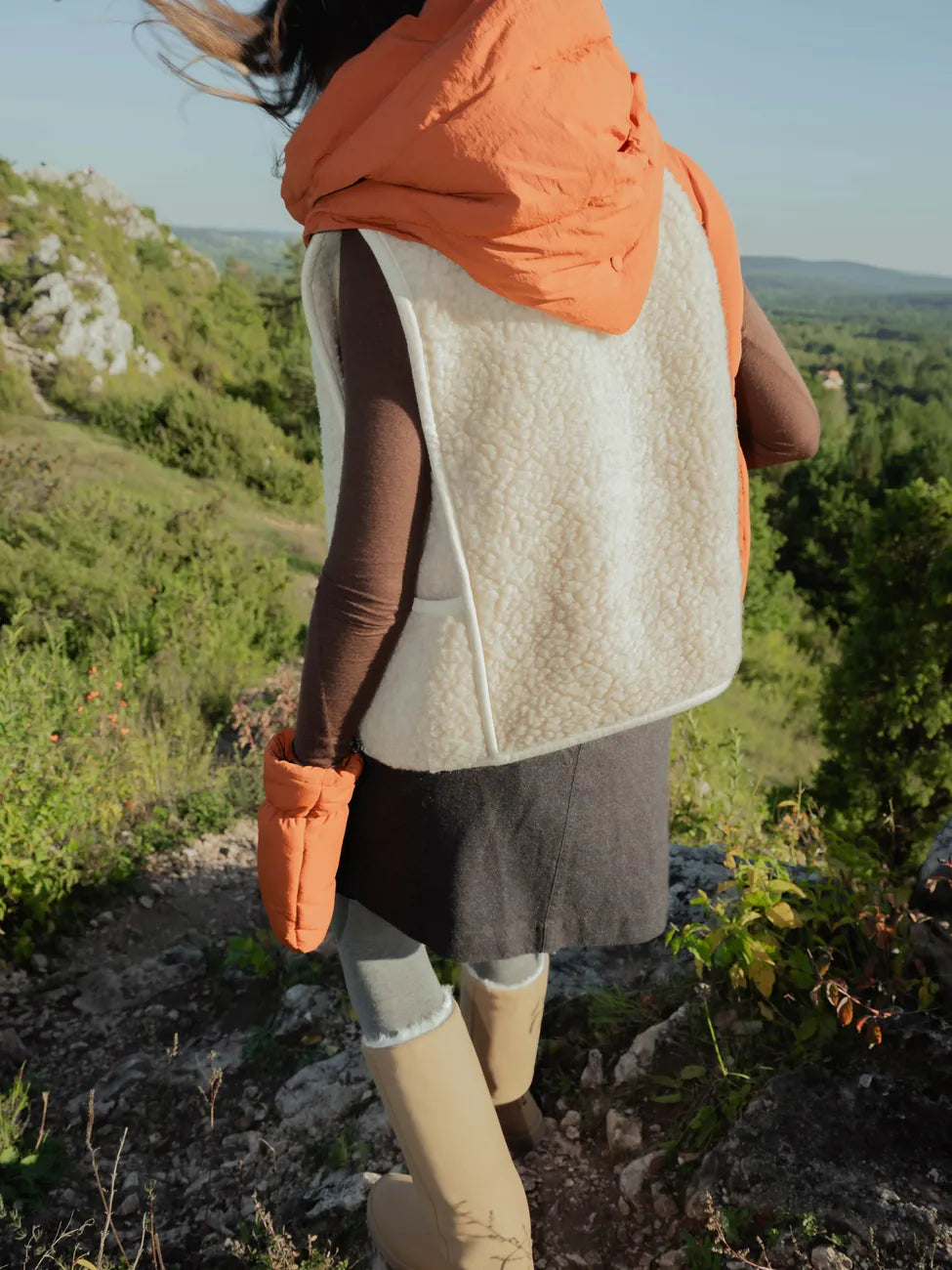 Vegan winter capuche in cinnamon color with recycled materials, worn over long-sleeve top and skirt outdoors. - The New Orchard - Fresh Cinnamon