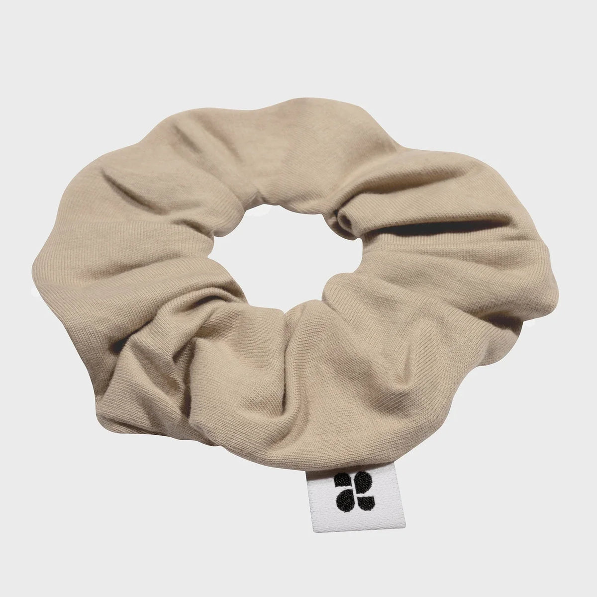 Sustainable beige scrunchie made from recycled materials