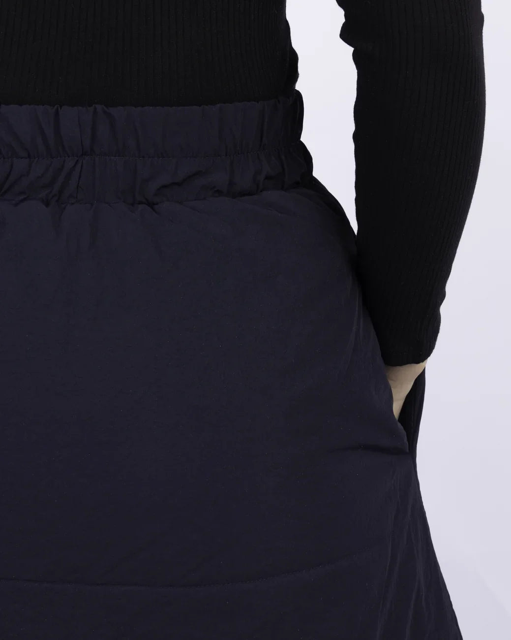 Navy vegan skirt with elastic waistband made from recycled materials, shown mid-length on model. - The New Orchard - Navy Blue / S