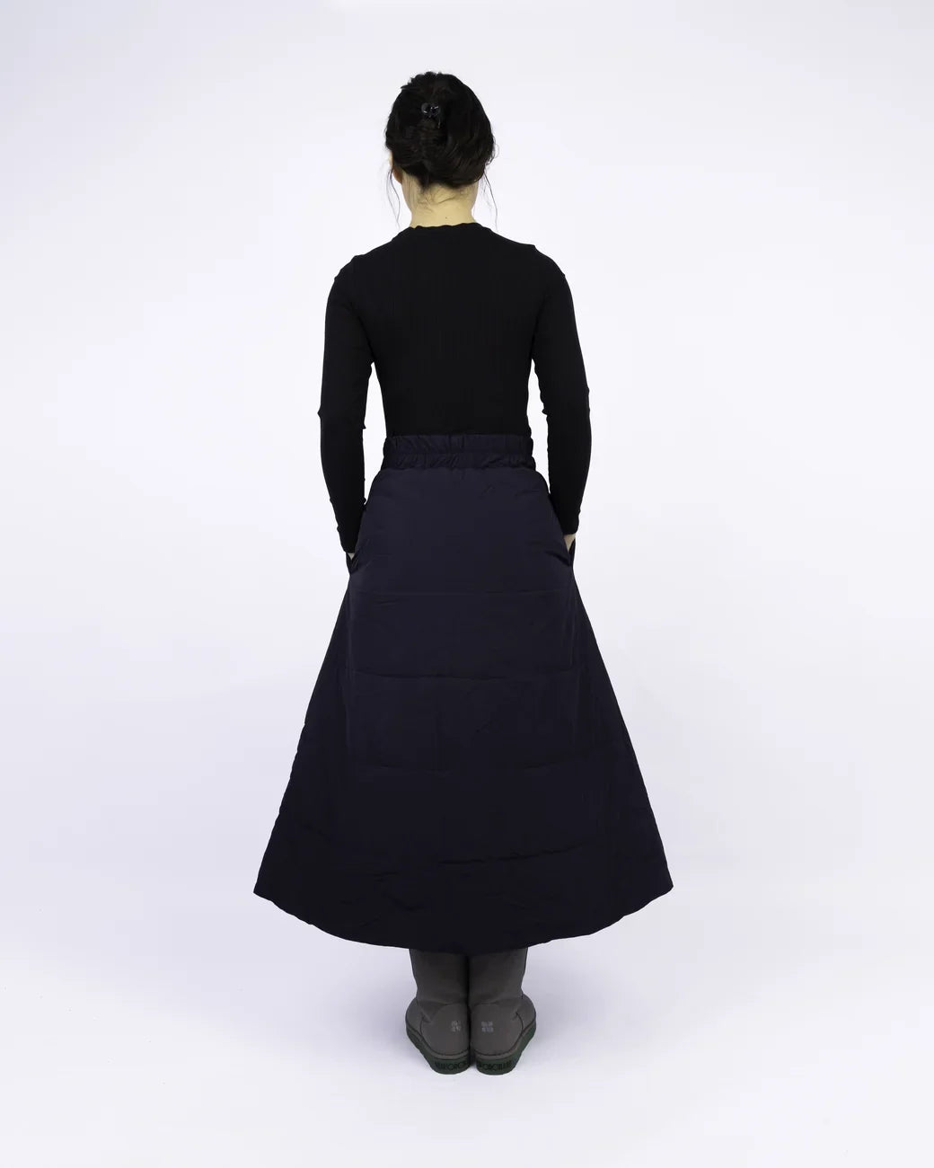 Navy blue A-line vegan skirt made from recycled materials, midi length, worn with black top and gray socks. - The New Orchard - Navy Blue / S