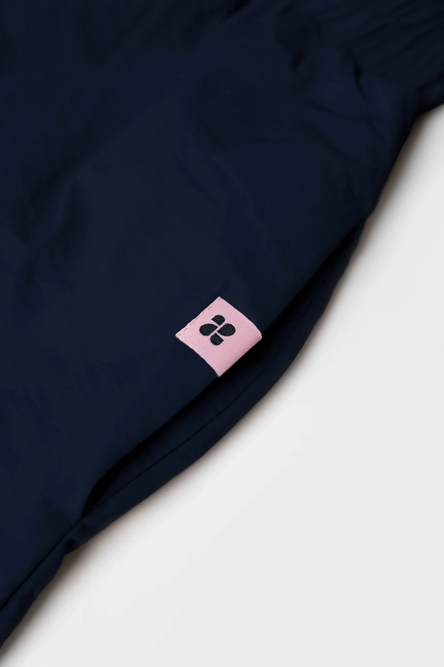 Navy vegan skirt made from recycled materials with pink branded tag detail. - The New Orchard - Navy Blue / S